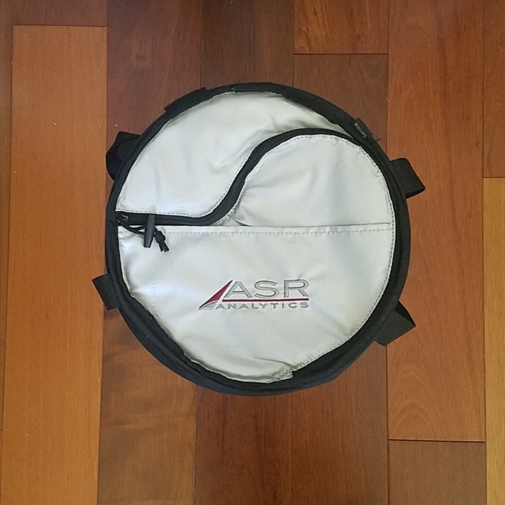 Collapsible cooler w/ attached beer bottle opener